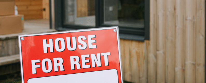 House for rent sign in front of modern home, highlighting rental property listing and real estate opportunity