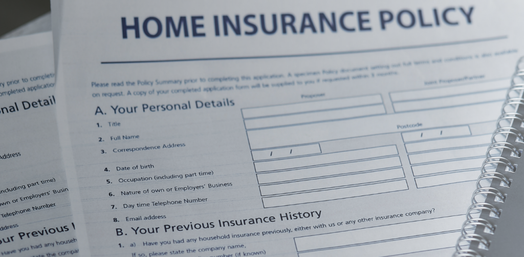 Close-up of a home insurance policy application form showing personal details and previous insurance history sections