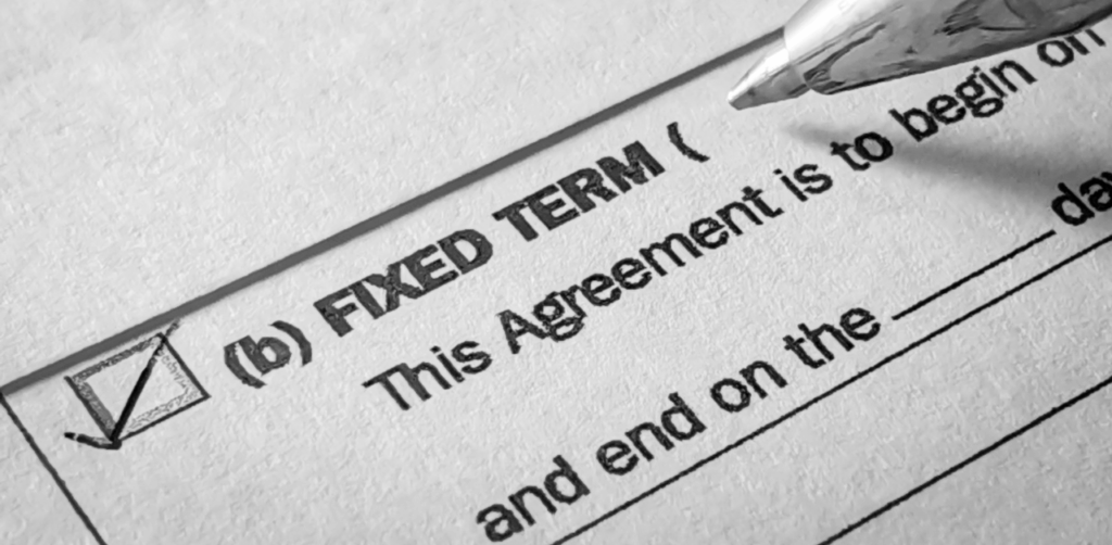 Close-up of a checked box for “Fixed Term” on a printed agreement form