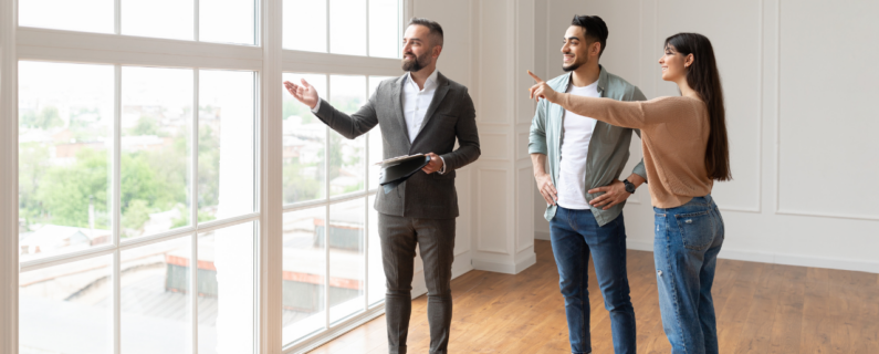Property Management Smiling couple touring a modern home with a real estate agent, admiring the large windows