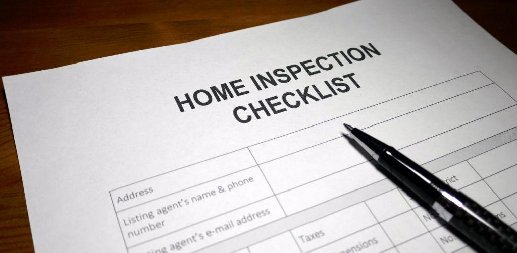 Property Management Close-up of a home inspection checklist form on a wooden desk, essential for qualifying for housing assistance programs
