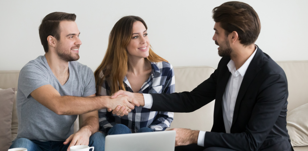 Property Management Young couple shaking hands with a real estate agent, discussing rental options and housing assistance support
