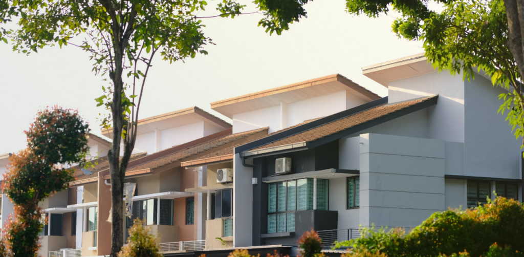 Modern suburban homes line a tree-lined residential street